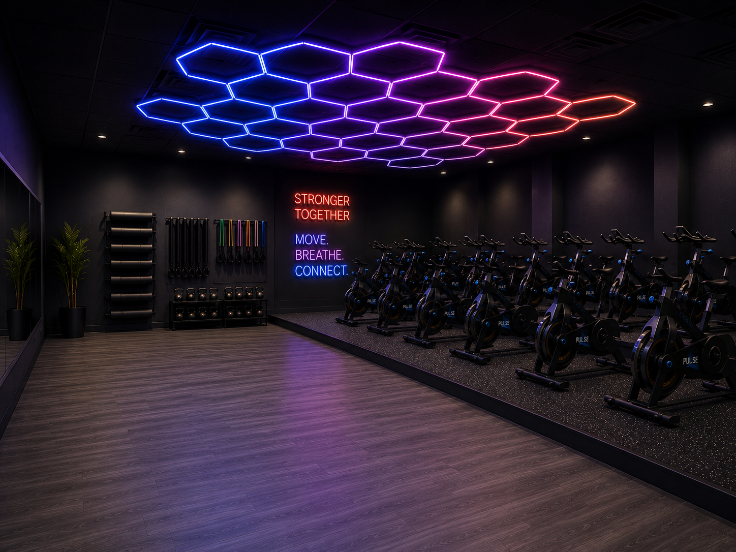 Interior of PULSE Studio with immersive lighting and group fitness setup